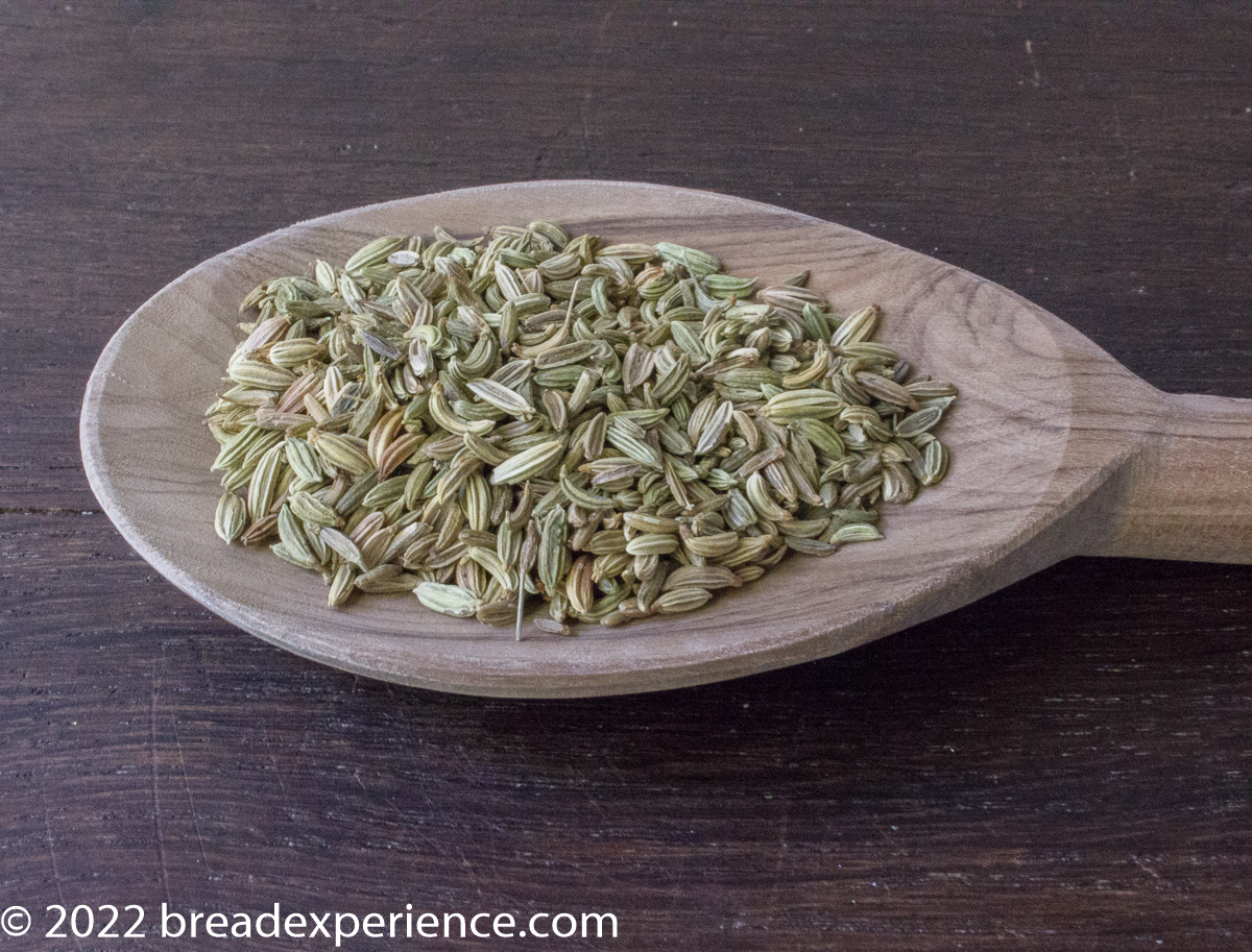 fennel seeds on a wooden spoon