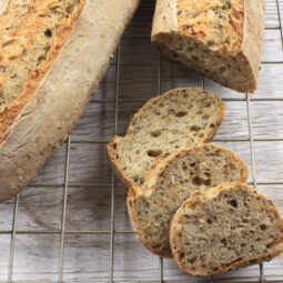 Five Grain Sourdough Rye Baguettes on cooling rack