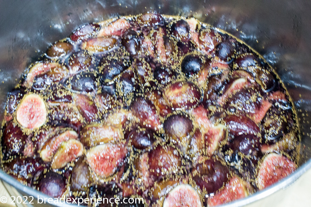 figs soaking in sugar in pan