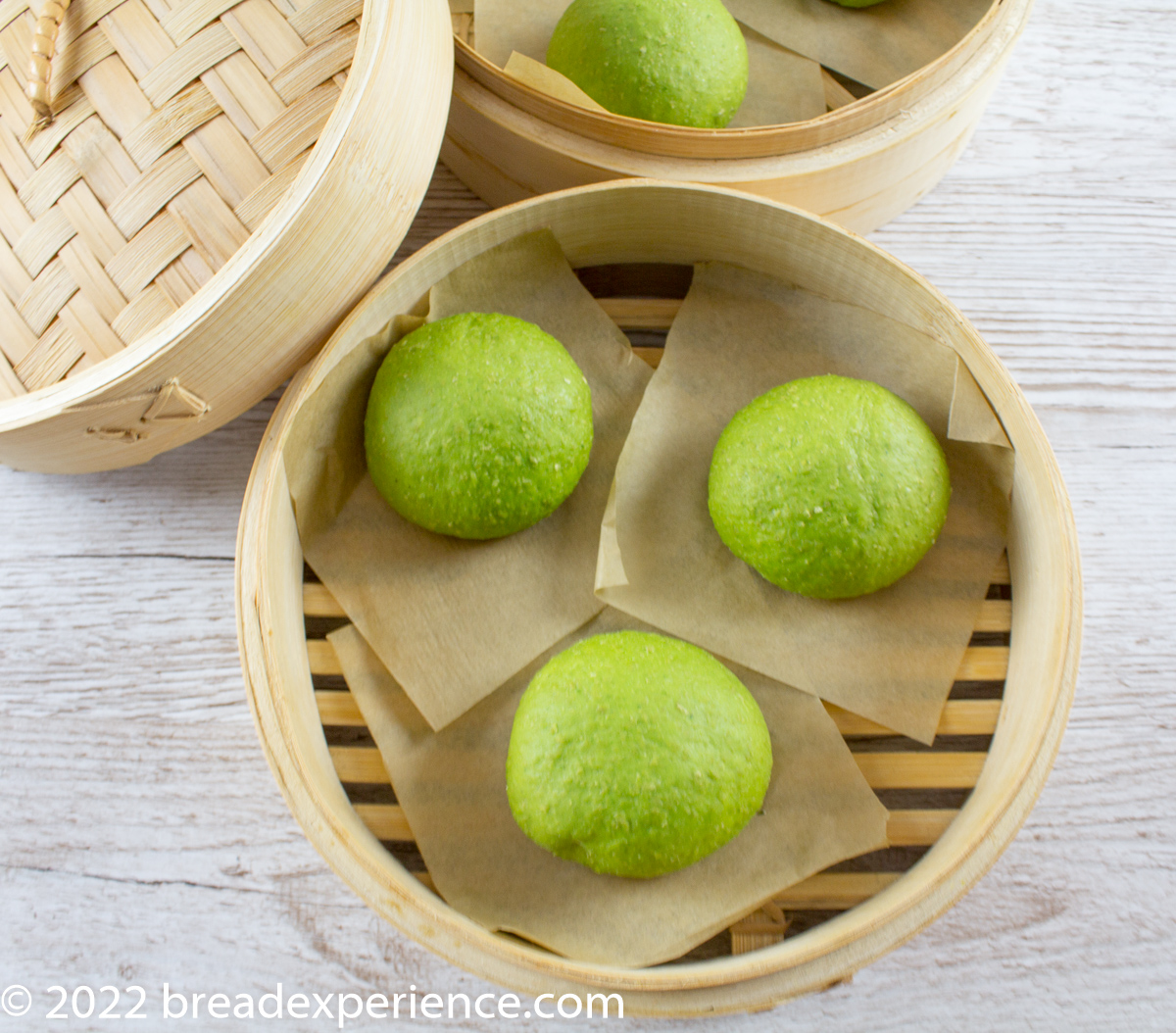 spinach buns in bamboo steamer